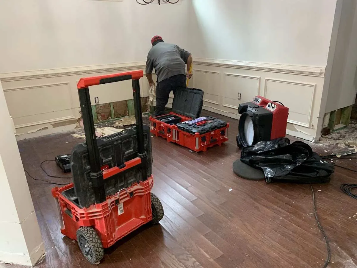 Technician setting up drying equipment for water damage in Montecito